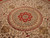 Detail of the 8 petal rosette medallion with concentric rings and small red heart motifs