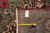 Back of the vintage Tabriz rug with tape measure and genuine hand-woven oriental rug tag