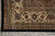 Ivory border corner with rust palmettes, olive leaves and a black outer guard stripe
