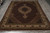 8' x 11'5" Persian Tabriz Mahi rug photographed flat on grey floor showing full medallion layout