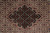 Macro detail of the dark medallion core with cream, rust and olive floral rosettes
