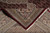 Corner folded back to reveal tight knot structure, cotton foundation and hand-tied ivory fringe