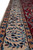 Ivory main border detail with blue palmettes, burgundy buds and salmon guard stripes