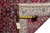 Back of the rug with tape measure and original inventory tag showing fine knot grid