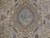 Close-up of the central medallion depicting the ruins and columns of Persepolis in soft blue