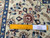Ruler laid across the pile showing authentic handmade weave near 500 knots per square inch