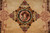 Detailed dragon medallion close-up showing silk sheen and hand-carved outlines around each motif