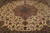 Close overhead of the rose and blue-green medallion set on a cream floral field