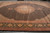 13'2" x 19'4" Tabriz rug photographed at an angle showing wide black floral main border