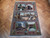 Burgundy and blue pictorial wool and silk rug laid flat on herringbone parquet floor