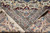 Corner fold showing cotton fringe, ivory reverse side and the fineness of the hand-knotted weave