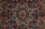 Close-up of the navy and brown central medallion with pink, red and green florals