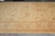 14' x 19'5" oversize wool rug photographed lengthwise showing soft gold field and ivory border
