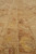 Detail of border guard stripes with gold vines, brown leaves and red highlights in wool
