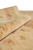 13x16 oversize wool rug rolled back to show pile depth and finished selvage