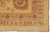 Corner detail of the triple border with palmettes, cross flowers and vine guard stripes