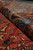 Rolled edge showing the low even wool nap and indigo blue border colors of the antique