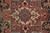 Detail of stepped medallion core showing red, ivory and soft green geometric floral drawing