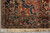 Corner section with ivory spandrel, salmon florals, navy guard border and ivory cotton fringe