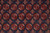 Close-up of quartered elephant foot guls in rust, ivory and burgundy on indigo blue wool