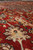 Macro of wool pile showing ivory palmette, soft sheen and hand-knotted 1970s Persian weave