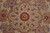 Center medallion detail showing 8 petal rosette, crimson core and silk highlighted vinework