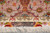 Signature cartouche woven "Iran Tabriz, Dezigner: Ali Ghaffari" above the cream fringe and pink border