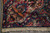 Corner detail showing navy guard border, ivory fringe and dense wool pile of 1940s rug
