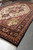 12x20 oversize Serapi Heriz rug photographed full length on the showroom floor with fringe