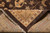 Folded back corner revealing knot density, cotton foundation and hand-tied ivory fringe