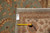 Reverse side with tag reading 12 12 and tape measure confirming size and knot density