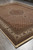 Vertical full-length photograph of 10'2 x 13'6 Oriental rug on grey tile floor