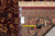 Back of the 8'6" x 11'6" rug with tape measure and genuine hand woven Oriental rug tag
