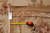Tape measure and hand woven Oriental rug tag confirming 12 x 15 foot dimensions on back