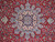 Close-up of sky blue and ivory star medallion set in red arabesque field