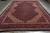 Navy and red Bijar rug laid flat in warehouse showing all-over Herati fish lattice