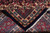 Folded edge showing weave density, navy outer band and original ivory cotton fringe together