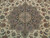 Close-up of layered medallion with blue, taupe and rust palmettes on ivory hand-knotted wool silk pile