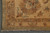 Ivory gold corner border with brown palmette, blue-grey leaves, rust dots and clean cotton fringe