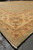 14x16 Peshawar wool rug seen from the side with fringe, gold border and green corner