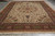 Ivory Sheik Safi field with vase motifs and rust burgundy border photographed on gray warehouse floor