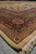 12x16 Persian Tabriz palace rug corner in low light, triple burgundy, olive and camel borders