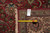 Reverse side with tape measure, fringe and hand woven Oriental rug identification tag visible