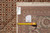 Back tag reading Mahi design, size 8.4 x 10.1, hand knotted in India