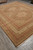 Angled floor view of brown and beige Oriental wool rug with ivory guard borders