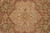 Detail of the center medallion with 8 petal rosette on a soft brown ground