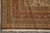Rug corner with layered floral borders, brown overcast selvage and hand-tied ivory fringe