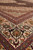 6x10 Tabriz rug corner angle showing mitred border corners and fine herati lattice field detail