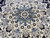 Close-up of the ivory medallion core with sky blue palmettes, brown accents and fine knotting