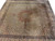 10x10 square Persian Tabriz Mahi rug viewed at an angle across a showroom floor